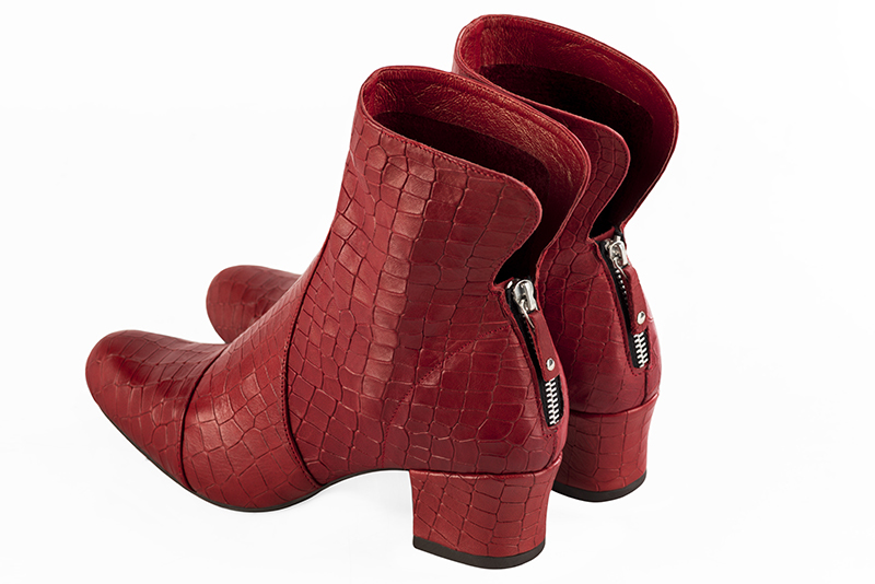 Scarlet red women's ankle boots with a zip at the back. Round toe. Low kitten heels. Rear view - Florence KOOIJMAN